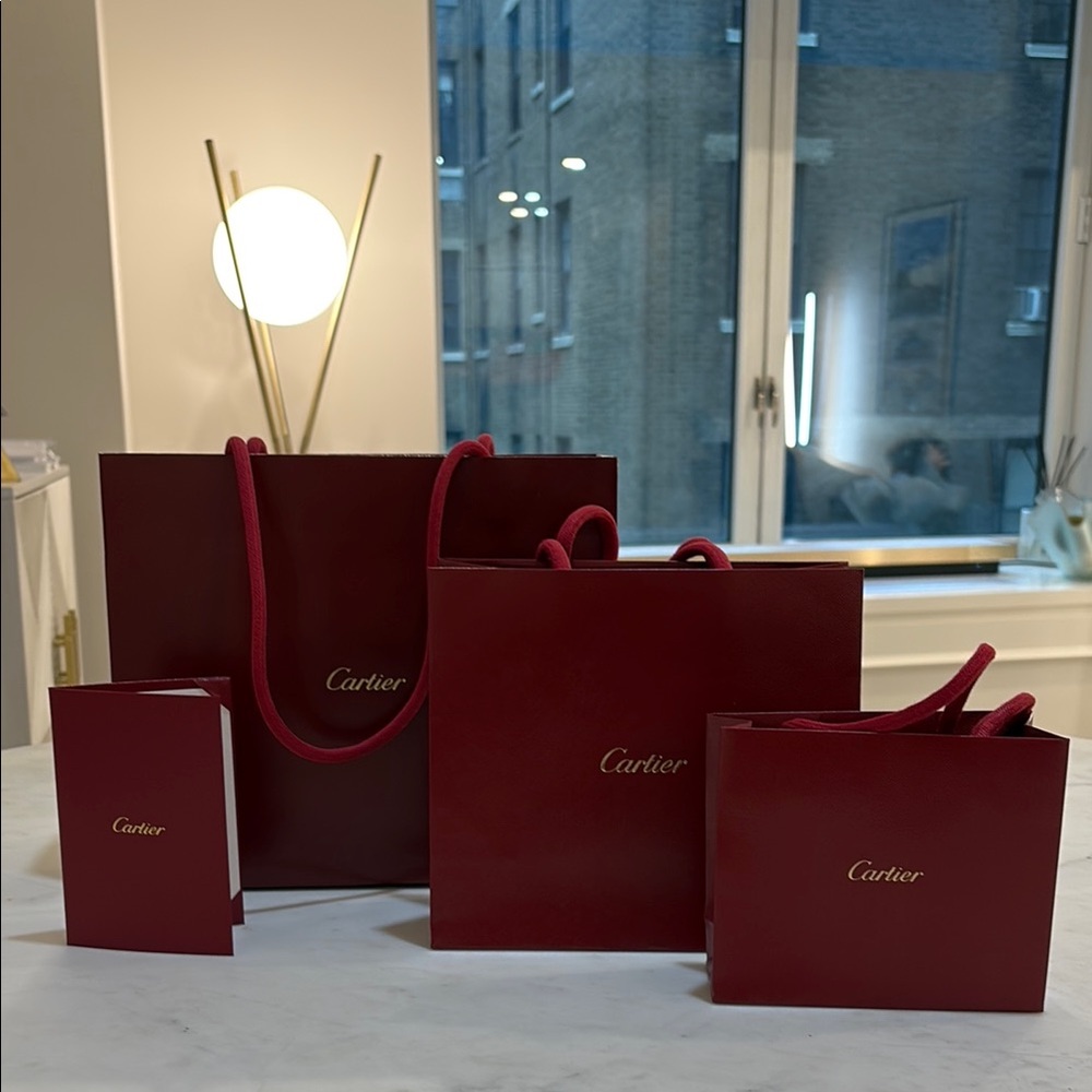 Cartier Red Luxury Bags with Gold Detailing